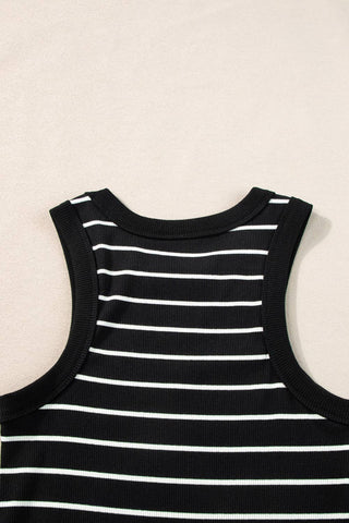 The Kannon Stripe Ribbed Knit Tank Mini Dress in black and white by Little Daisy Closet is shown from the back, laid flat on a neutral surface. This dress features horizontally aligned stripes and a ribbed texture.