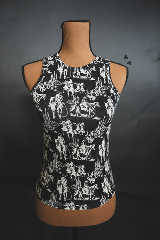 A mannequin displays the DUSK DESERT TANK by 2 Fly, a black sleeveless tank top featuring intricate white Renaissance-style patterns. The rounded neckline and form-fitting design make it a versatile choice for all-season wear, set against a dark background.