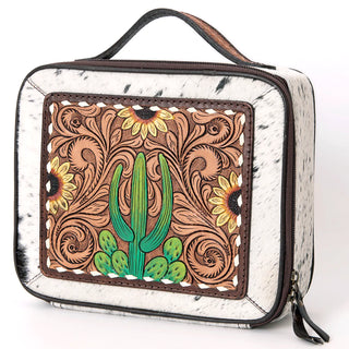 Introducing the Carson Cowhide and Tooled Leather Travel Jewelry Case by American Darling—a rectangular bag made of vegetable tanned cowhide-patterned leather with a convenient handle on top. The front features an intricate design showcasing a central green cactus, surrounded by sunflowers and ornate swirls in shades of brown, green, and yellow. Crafted from genuine leather, this travel case is equipped with durable zipper closures for added security.
